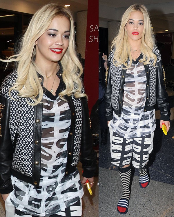 Rita Ora in a Fausto Puglisi bomber jacket featuring geometric print and leather sleeves with gold-tone and crystal embroidery