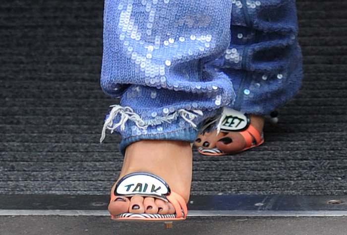 Showcasing her quirky style, Rita Ora completed her look with Sophia Webster's whimsical coral "Sweet Talk" sandals