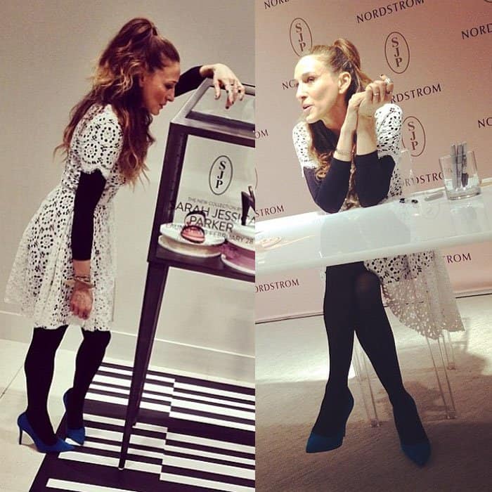 Sarah Jessica Parker showcases her SJP Collection in a white Dolce Gabbana eyelet dress, layered over a full-length black bodysuit, at The Grove in Los Angeles on March 6, 2014