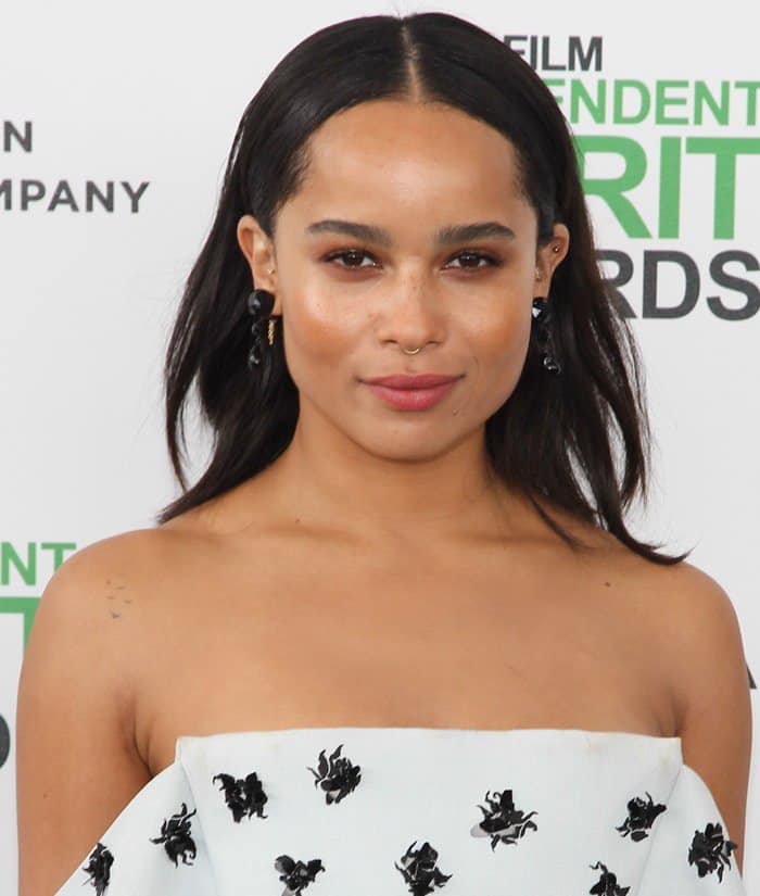 Zoë Kravitz wearing a small golden ring in her septum piercing