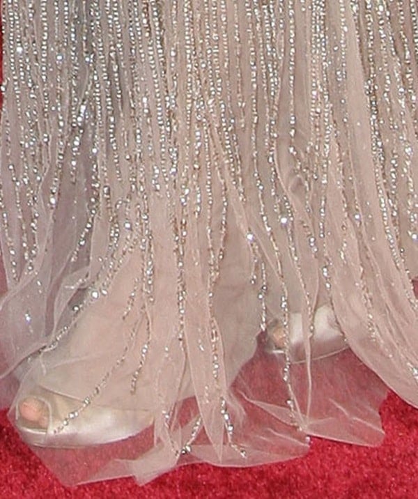 A closer look at Angelina Jolie’s satin peep-toe Ferragamo pumps peeking through her beaded Elie Saab gown at the 2014 Oscars
