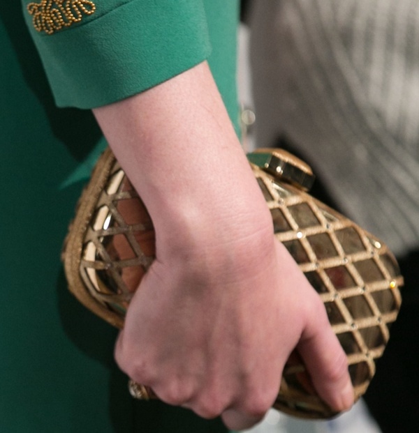 Christina Hendricks toted a gold clutch at the ‘Mad Men’ presentation
