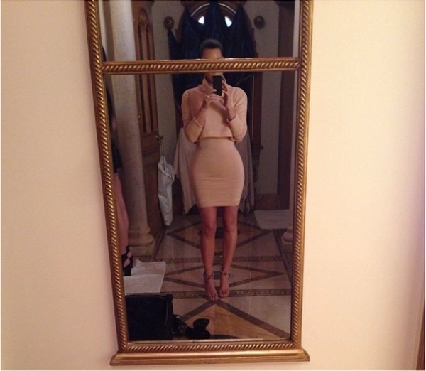 Kim Kardashian’s Instagram photo captioned “Today’s Look – #KardashianKollectionCroppedTurtleneck #VintageAlaiaDress #AlaiaHeels,” posted on March 13, 2014, showcasing her figure-hugging nude ensemble paired with sleek Alaïa heels that added height and elegance