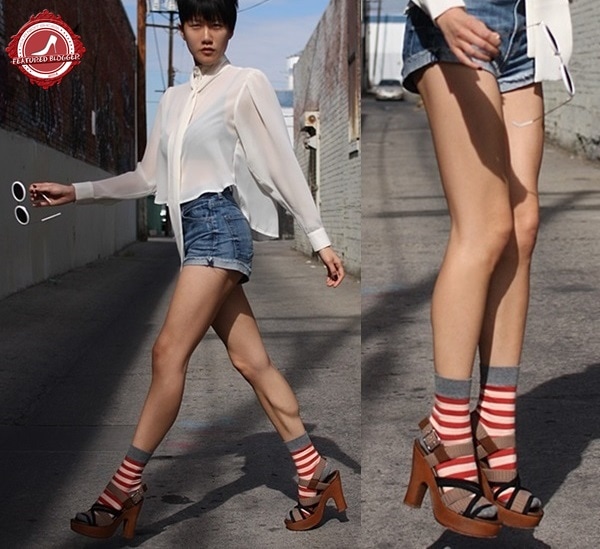 Paanie Pho sporting platform sandals and contrasting striped red socks