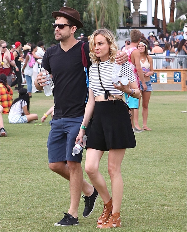 Diane Kruger and Joshua Jackson stroll through Coachella’s grassy grounds, blending laid-back festival dressing with effortless couple style