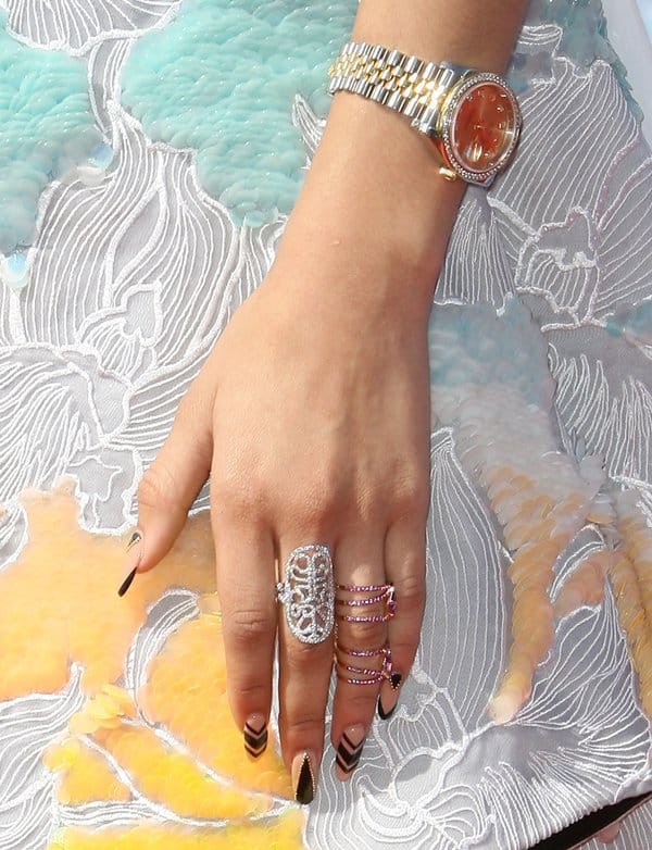 Zendaya's stylish watch, intricate statement rings, and chic manicure