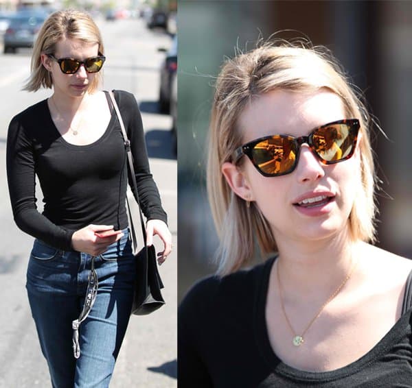 Emma Roberts wearing funky sunglasses while shopping