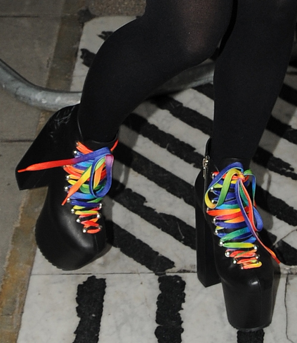 Lily Allen in black boots with striking rainbow laces
