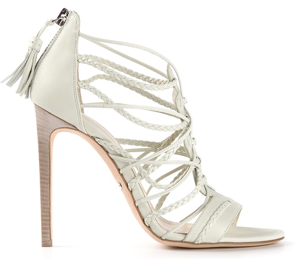 This angled product shot highlights the Roberto Cavalli braided leather sandal’s sculptural crossover straps, tassel-zip back, and sleek stacked stiletto heel