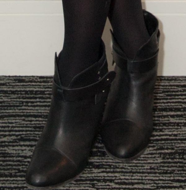 A closer look at Rag Bone’s “Harrow” booties reveals their sculptural split shaft, wraparound strap detail, and stacked heel