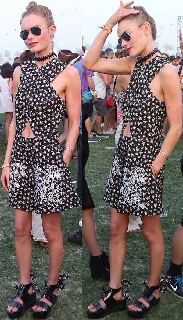 Kate Bosworth in a black romper with crossover cutout details and floral prints from Carven’s Spring 2014 collection