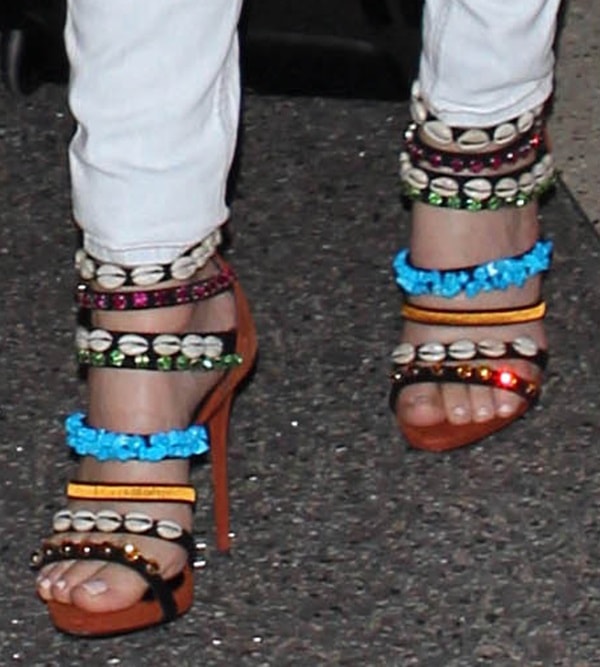 A closer look at Khloé Kardashian’s pedicure and intricate Giuseppe Zanotti sandals, with rows of shells and jewel-toned embellishments wrapping the foot and ankle