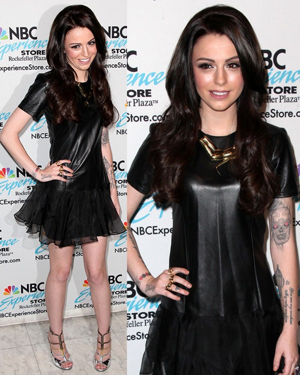 Cher Lloyd in little black leather dress with short sleeves and a sheer skirt overlay