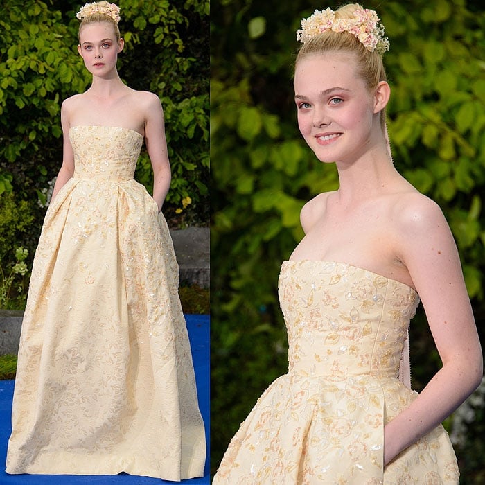 Elle Fanning looks like a storybook princess in a strapless, floral-embellished Georges Hobeika couture gown with a delicate flower crown at the Maleficent reception at Kensington Palace