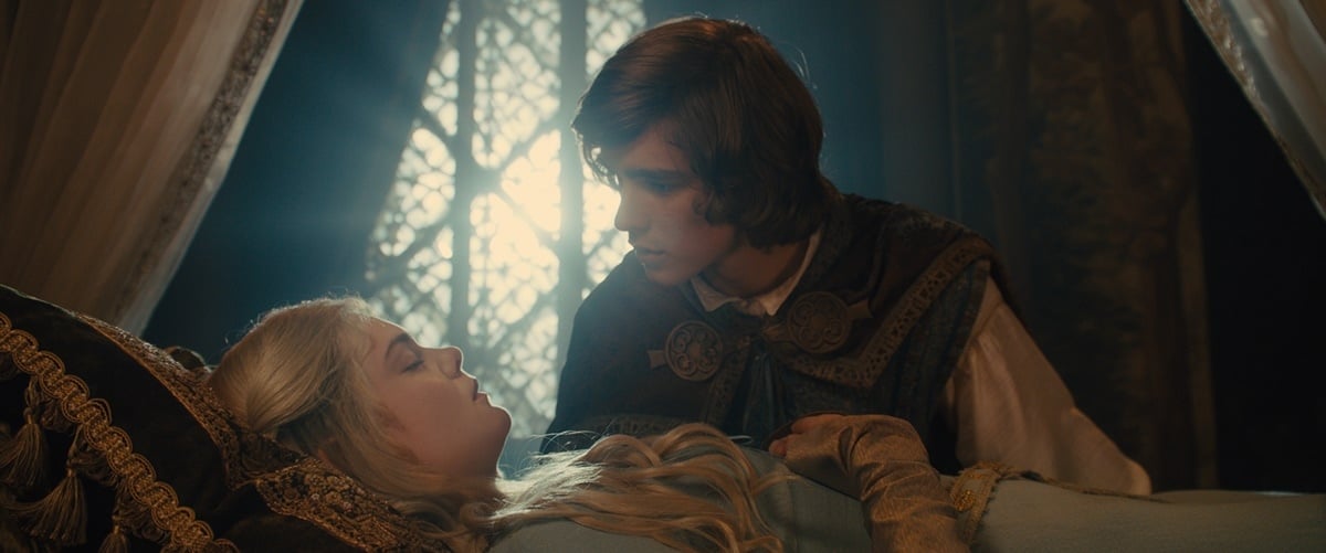 Elle Fanning as Aurora, daughter of Queen Leila King Stefan, and Brenton Thwaites as Prince Phillip in the 2014 American fantasy film Maleficent