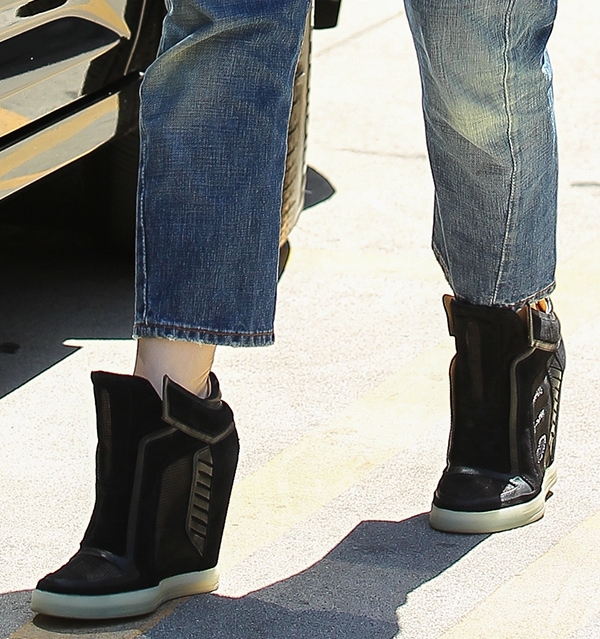A closer look at Gwen Stefani's trendy black wedge sneakers from her own label, L.A.M.B., perfectly paired with relaxed L.A.M.B. crop jeans