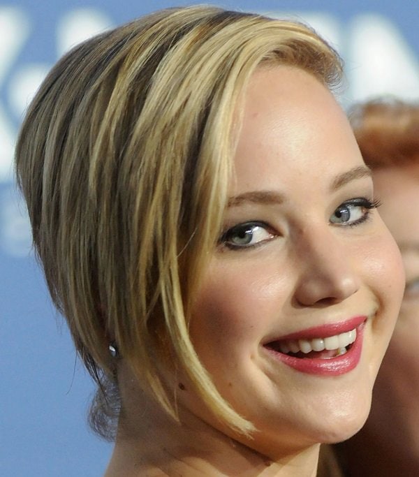 With her hair styled in a chic, swept-to-the-side 'do, Jennifer Lawrence smiled warmly for the cameras