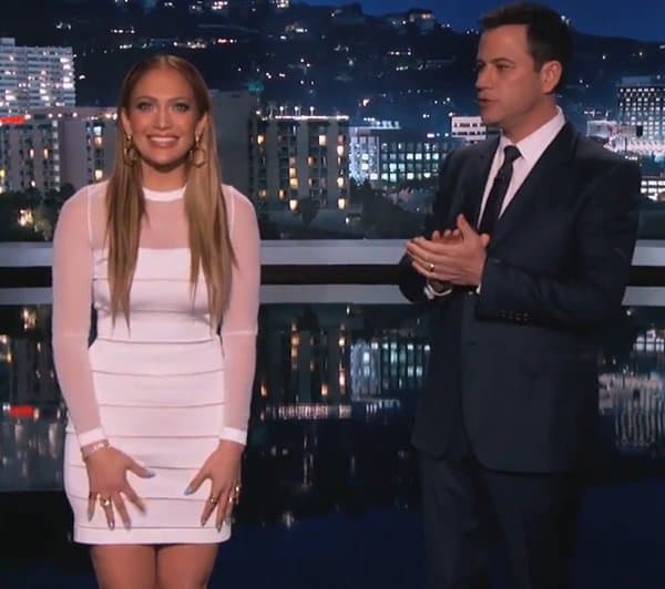 Jennifer Lopez lights up Jimmy Kimmel Live! in a sleek white Balmain sheath dress with sheer paneling, showcasing her signature blend of sophistication and sex appeal