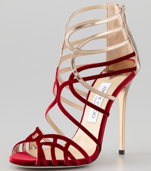 The Jimmy Choo "Maury" paired crimson velvet straps with metallic gold leather, creating a cage-like silhouette that became one of the brand's signature evening-sandal designs of the 2010s