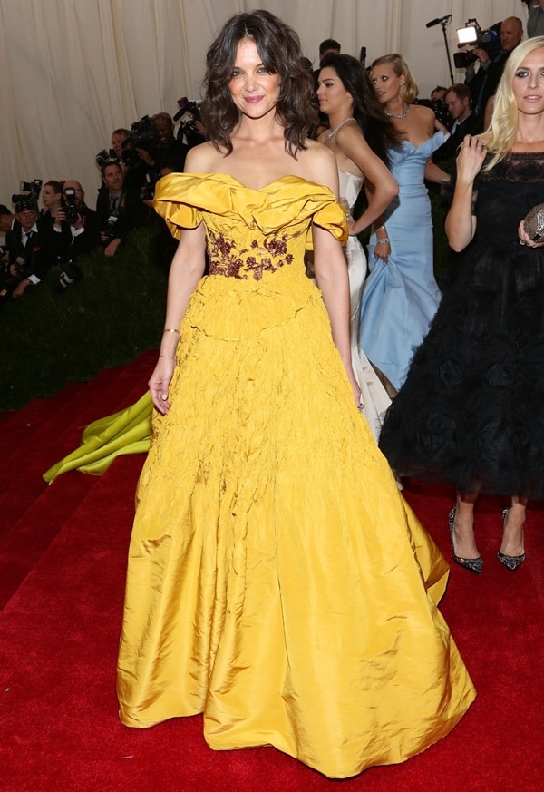 Katie Holmes wearing a bright mustard yellow Marchesa Fall 2014 gown at the 2014 Met Gala