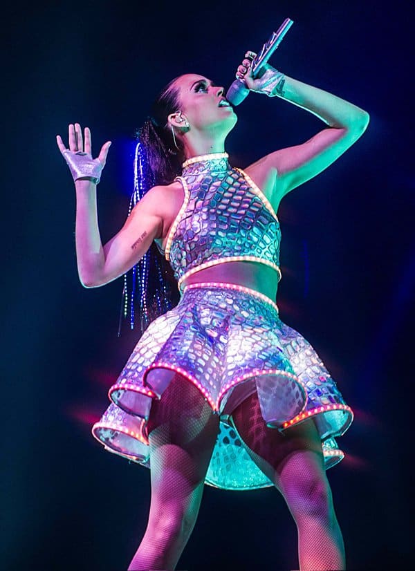 Katy Perry mesmerizes the audience with her vibrant performance and glowing mirrored outfit during her Prismatic World Tour