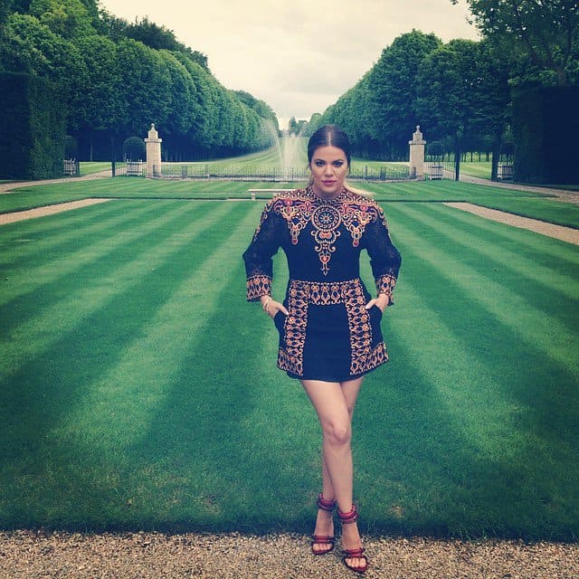 Khloé Kardashian posing in front of the Chateau de Wideville grounds