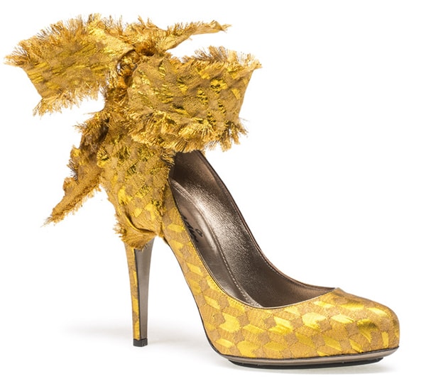 Lanvin Brocade Ankle-Tie Pumps in metallic gold jacquard feature frayed wraparound ribbons, a softly pointed toe, and a slim stiletto heel, originally retailing for $1,190