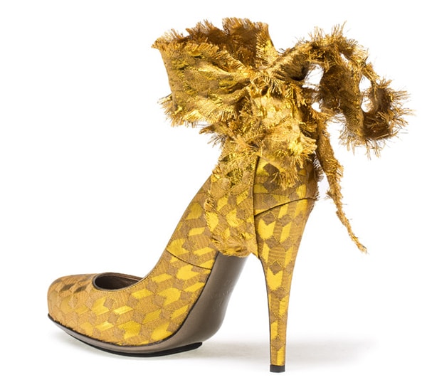 Lanvin Brocade Ankle-Tie Pumps in metallic gold jacquard feature frayed wraparound ribbons, a softly pointed toe, and a slim stiletto heel, originally retailing for $1,190