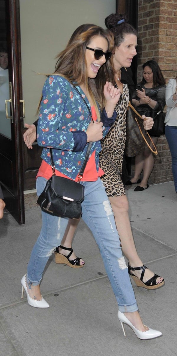Lea Michele wears a floral jacket while leaving her hotel