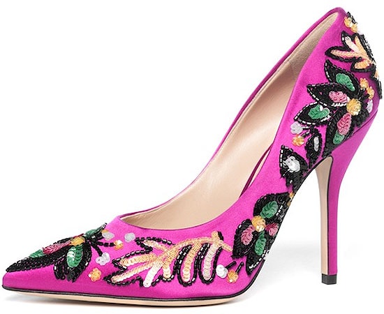 Paul Andrew’s “Shakti Soir” hand-embroidered fuchsia satin pumps dazzle with intricate beadwork and bold floral motifs, turning a classic stiletto into a statement piece