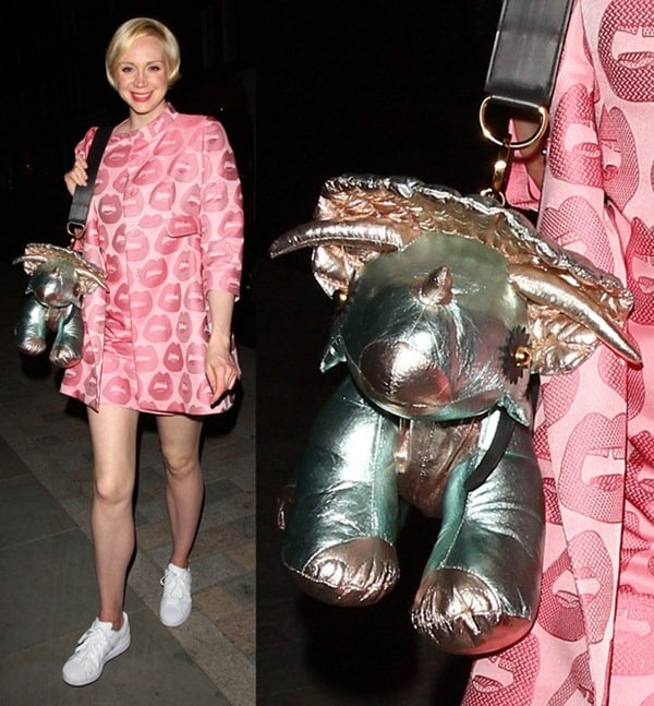 Gwendoline Christie makes a bold fashion play in a pink lips-print mini dress and sneakers, accessorized with a whimsical metallic rhino-shaped purse at a Prada after-party in London
