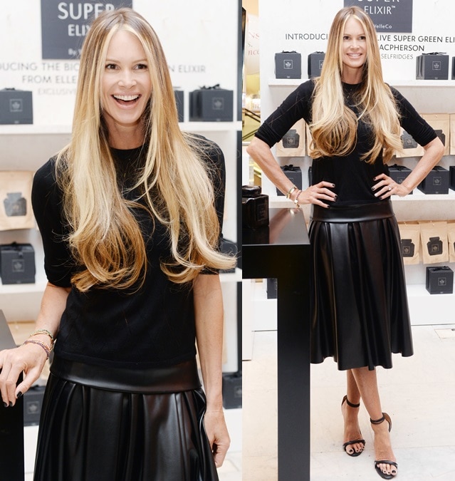 Elle Macpherson paired a pleated leather midiskirt with a leather-trimmed sweater