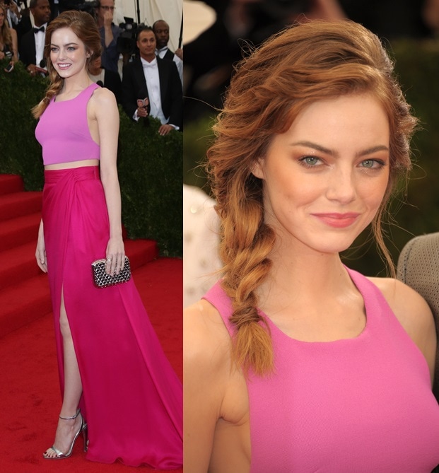 Emma Stone embraced modern elegance in a custom Thakoon look, pairing a fuchsia crop top with a hot-pink wrap skirt and metallic accessories for a fresh, youthful red carpet moment