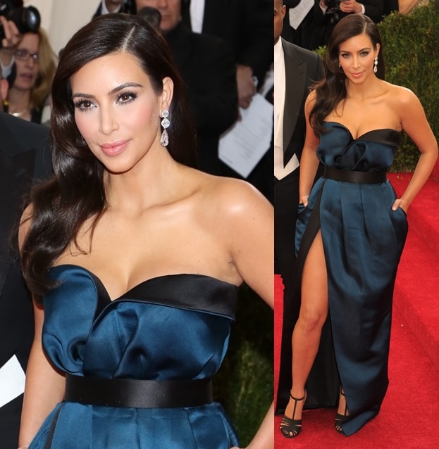 Kim Kardashian balanced her sculptural midnight-blue strapless gown with sleek black ankle-strap heels, letting the minimalist sandals sharpen the look’s modern red-carpet polish