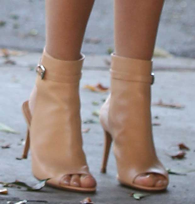 The nude shade of Ashley Tisdale’s Gianvito Rossi sandal booties closely matches her skin tone, creating a seamless leg-lengthening effect that visually adds height to her petite 5ft 2½ frame