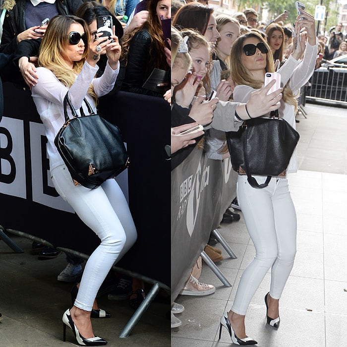Cheryl Cole effortlessly angles herself for the perfect selfie with fans