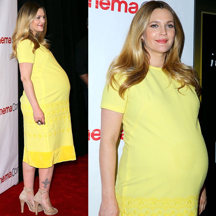 Drew Barrymore glows in a vintage Ludwig Boutique yellow shift dress with floral embroidery and a silk hem, paired with woven sandals at the Warner Bros. Pictures event during CinemaCon 2014