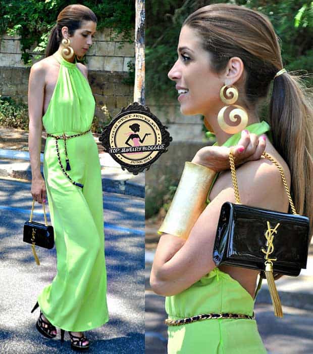 Italian fashion blogger Fabrizia Spinelli styled her green jumpsuit with spiral earrings and an oversized cuff
