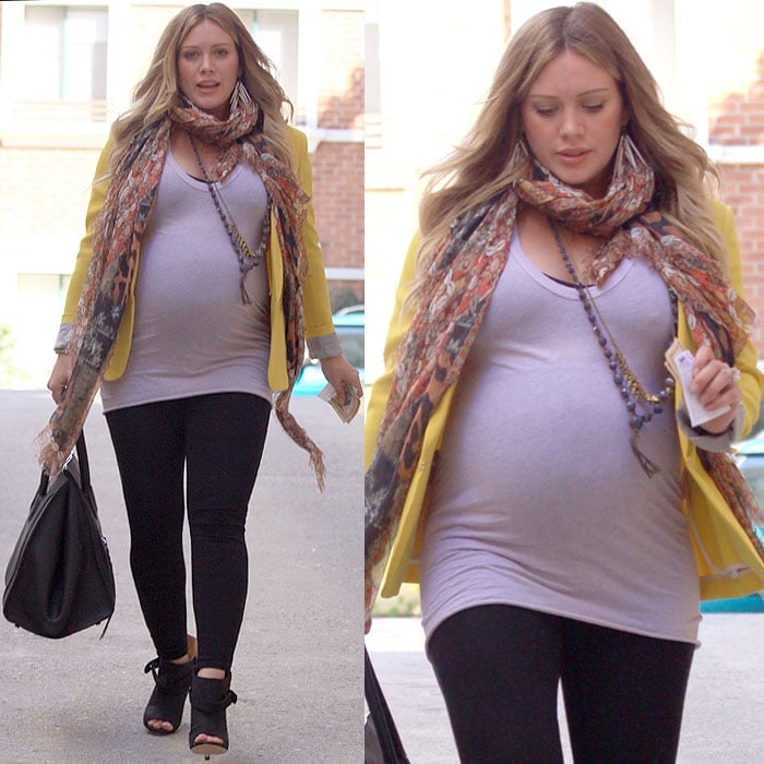 Hilary Duff was spotted leaving a doctor’s appointment on February 9, 2012, wearing a chic Alexander McQueen silk patchwork logo scarf, a Stella McCartney tailored boyfriend blazer, Maison Martin Margiela belted open-toe booties, Ashley Pittman light horn quill earrings, a Celine Boston bag, a maternity T-shirt from A Pea in the Pod, and David Lerner signature leggings