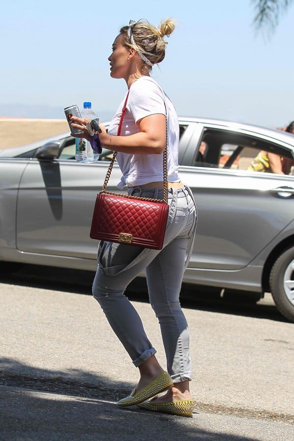 Hilary Duff in retro dungarees and red lipstick