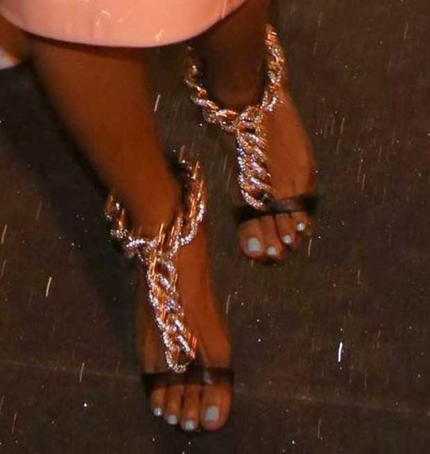 Karrueche Tran steps out in statement Giuseppe Zanotti heels featuring bold chain-embellished straps and sparkling details