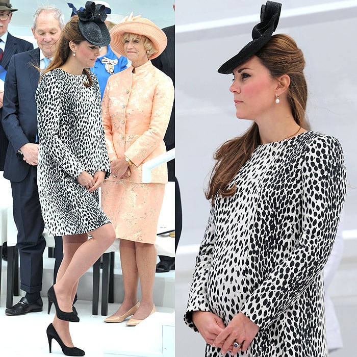 Kate Middleton dazzled at the Princess Cruises Naming Ceremony on June 13, 2013, wearing a Hobbs Dalmatian Mac coat, Sylvia Fletcher hat, Annoushka pearl drop earrings, Episode Angel pumps, and her iconic Garrard sapphire engagement ring