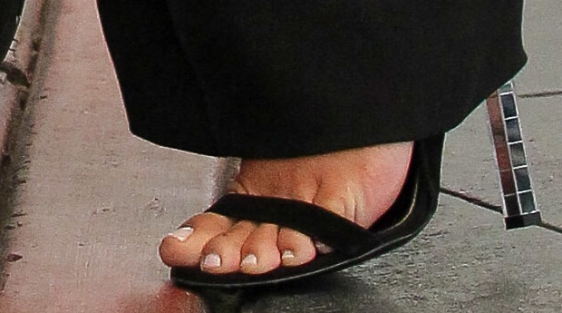 Kim Kardashian shows off her feet in mirrored heels from the Tom Ford Spring 2014 Collection