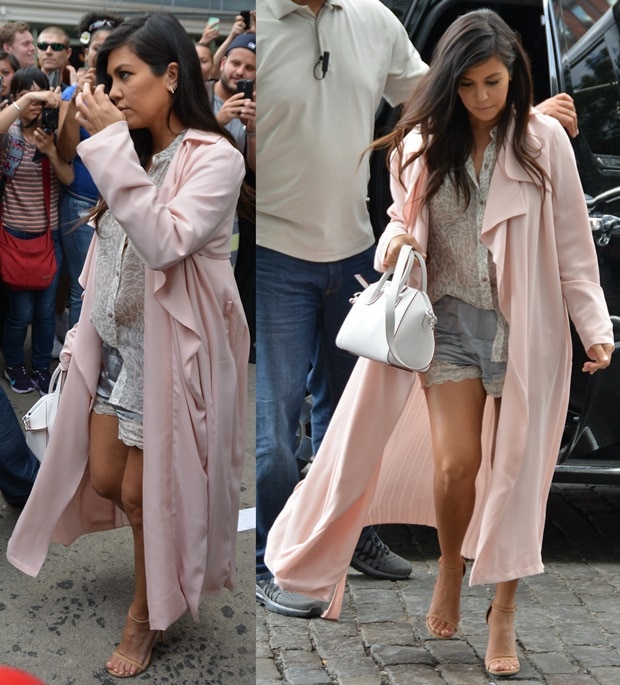 Kourtney Kardashian flaunts her legs in a soft pink trench coat