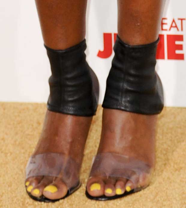 A closer look at Mary J. Blige’s footwear reveals the transparent PVC trend in its early luxury form, accented by matching yellow pedicure and four-inch stiletto heels