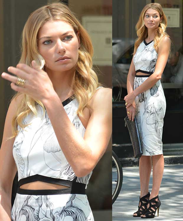 Jessica Hart shows how to style a cutout dress with a monochrome floral pattern, pairing it with black caged Miu Miu sandals for a chic and modern street-style look shooting in Soho, Manhattan, New York City