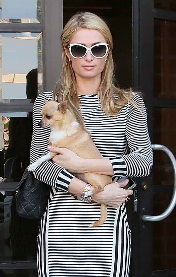 Paris Hilton’s fitted striped dress showcased the clean, streamlined silhouette that defined much of her off-duty style in the early 2010s