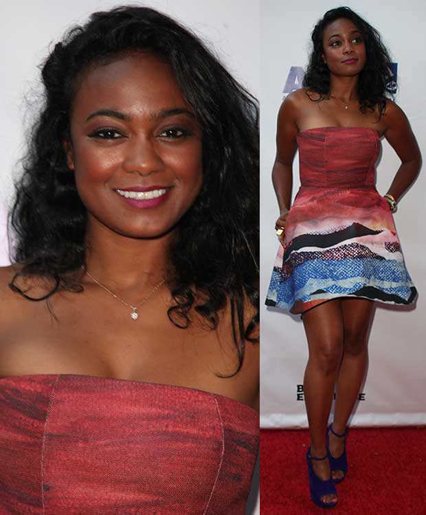 Tatyana Ali lit up the red carpet in a strapless Angelys Balek mini dress with abstract red and ocean-blue prints, blending playful energy with effortless sophistication
