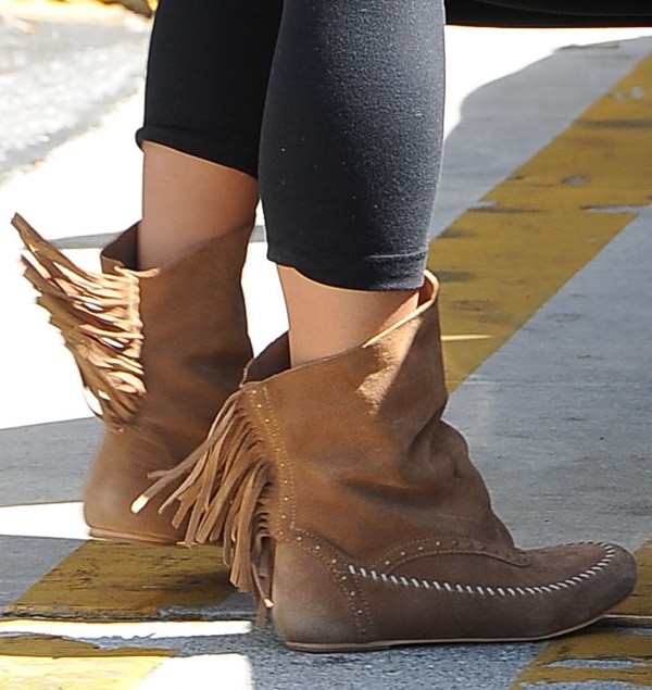Vanessa Hudgens in Koolaburra Becca boots with fringe details and a slouchy look