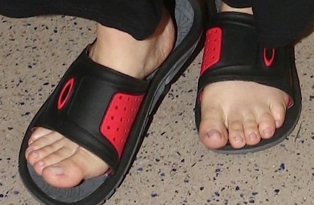 Khloé Kardashian steps out in black and red Oakley flip-flops